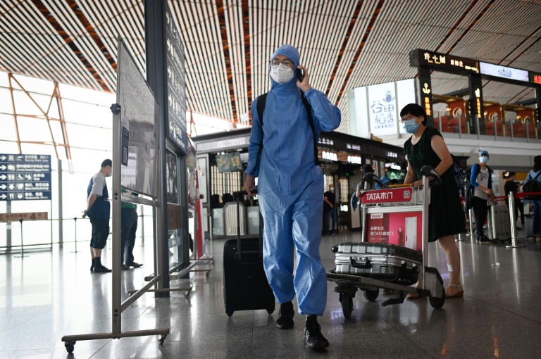 Beijing cancels flights, shuts schools over new virus outbreak