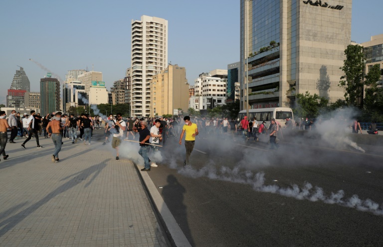 Dozens wounded in clashes as hundreds of protesters flood Beirut